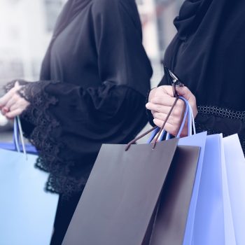 Emarati Arab women coming out of shopping in Dubai, United Arab Emirates.